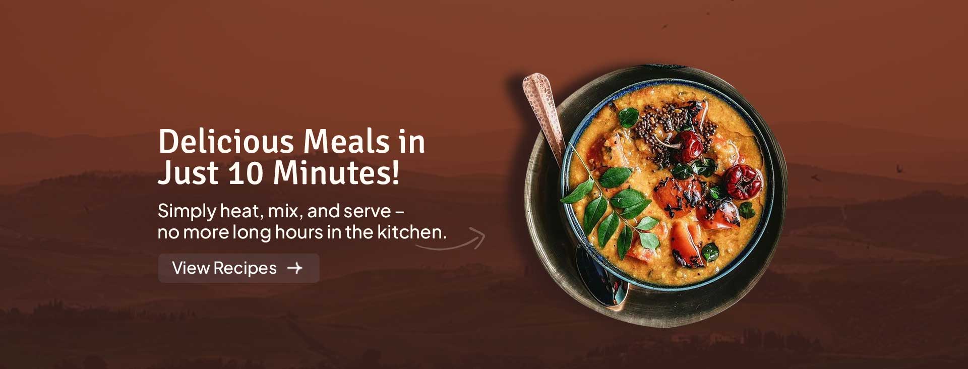 Vibrant yellow curry base served with naan and spices